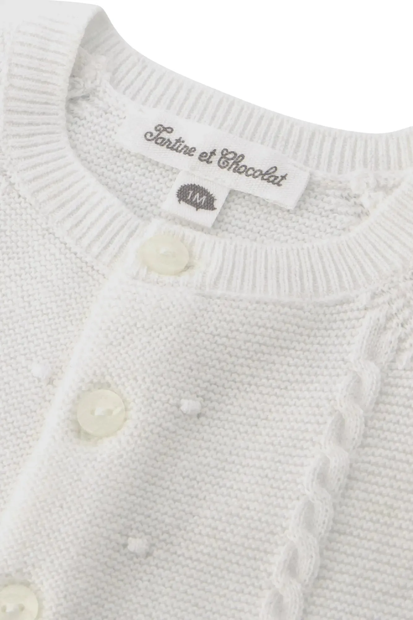 Boy's white cable knitted cardigan